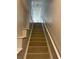 Indoor staircase with light wood laminate at 5600 Bentgrass Dr # 103, Sarasota, FL 34235