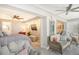 Spacious main bedroom with access to sitting area and TV at 9393 Midnight Pass Rd # 503, Sarasota, FL 34242