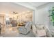 Open living room with kitchen view, featuring comfortable seating and tile floors at 9393 Midnight Pass Rd # 503, Sarasota, FL 34242