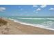 Expansive beach with ocean waves at 9393 Midnight Pass Rd # 503, Sarasota, FL 34242