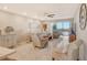 Relaxing living room with stunning water views and comfortable furnishings at 9393 Midnight Pass Rd # 503, Sarasota, FL 34242