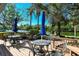 Enjoy waterfront views from this relaxing deck, complete with tables and chairs at 9393 Midnight Pass Rd # 503, Sarasota, FL 34242