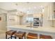 Modern kitchen boasts stainless steel appliances and an island with seating at 9393 Midnight Pass Rd # 503, Sarasota, FL 34242