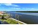 Scenic waterfront view with palm trees and waterway at 9393 Midnight Pass Rd # 503, Sarasota, FL 34242