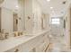 Updated bathroom with double vanity, custom cabinetry and shower at 9393 Midnight Pass Rd # 503, Sarasota, FL 34242