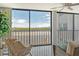 Stunning water view from living room, showcasing serene scenery at 9393 Midnight Pass Rd # 503, Sarasota, FL 34242