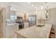 Modern kitchen with stainless steel appliances and white cabinets at 9393 Midnight Pass Rd # 503, Sarasota, FL 34242