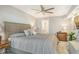 King-size bed in main bedroom with updated decor and private access to bathroom at 9393 Midnight Pass Rd # 503, Sarasota, FL 34242