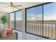 Expansive water view from large windows, offering a relaxing atmosphere at 9393 Midnight Pass Rd # 503, Sarasota, FL 34242