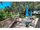 Relaxing deck overlooking the water with patio furniture at 9393 Midnight Pass Rd # 503, Sarasota, FL 34242