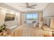 Main bedroom with water view and king-size bed, offering a relaxing retreat at 9393 Midnight Pass Rd # 503, Sarasota, FL 34242