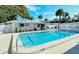 Inviting community pool with surrounding patio furniture at 6041 Lilli Way # 72, Bradenton, FL 34207