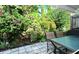 Private patio with table and chairs, surrounded by lush greenery at 6041 Lilli Way # 72, Bradenton, FL 34207