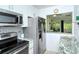 Kitchen boasts granite countertops, stainless steel appliances, and a breakfast bar at 6041 Lilli Way # 72, Bradenton, FL 34207