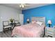 Bedroom with light pink bedding, ceiling fan, and lots of natural light at 6041 Lilli Way # 72, Bradenton, FL 34207