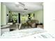 Open living room and dining area with comfy seating and access to backyard at 6041 Lilli Way # 72, Bradenton, FL 34207