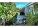 Stone patio walkway leads to a private backyard patio with seating at 6041 Lilli Way # 72, Bradenton, FL 34207