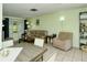 Bright living room featuring a sofa, dining table, and neutral color scheme at 6041 Lilli Way # 72, Bradenton, FL 34207