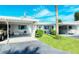 Two-unit building with carport parking and well-maintained landscaping at 6041 Lilli Way # 72, Bradenton, FL 34207