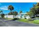 Quaint single story home with light blue exterior and white fence at 6041 Lilli Way # 72, Bradenton, FL 34207