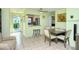Bright dining area with seating for four and view into the kitchen at 6041 Lilli Way # 72, Bradenton, FL 34207