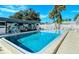 Inviting community pool with a tropical mural and ample lounge chairs at 6041 Lilli Way # 72, Bradenton, FL 34207