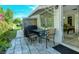Small patio area with table and chairs, adjacent to the house at 6041 Lilli Way # 72, Bradenton, FL 34207