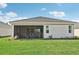 Screened patio and grassy backyard at 12584 Wellen Golf St, Venice, FL 34293