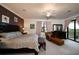 Large main bedroom with plush bed and sitting area at 17825 Gawthrop Dr # 103, Bradenton, FL 34211