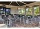 Outdoor community clubhouse with covered patio, bar, and seating at 17825 Gawthrop Dr # 103, Bradenton, FL 34211