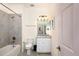 Clean bathroom with granite countertop, white cabinets, and a shower/tub combo at 17825 Gawthrop Dr # 103, Bradenton, FL 34211