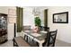 Bright dining room with stylish chandelier at 17825 Gawthrop Dr # 103, Bradenton, FL 34211