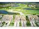 Aerial view of community featuring homes, golf course, and lakes at 17825 Gawthrop Dr # 103, Bradenton, FL 34211