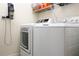 Laundry room with washer, dryer, and shelving for storage at 17825 Gawthrop Dr # 103, Bradenton, FL 34211