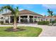 Exterior view of community clubhouse with patio seating at 17825 Gawthrop Dr # 103, Bradenton, FL 34211