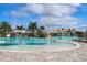 Stunning pool area with a rock waterfall and shaded seating at 17825 Gawthrop Dr # 103, Bradenton, FL 34211