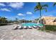 Resort-style pool with plenty of lounge chairs and a waterfall feature at 17825 Gawthrop Dr # 103, Bradenton, FL 34211