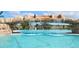 Relaxing resort-style pool with a large waterfall feature at 17825 Gawthrop Dr # 103, Bradenton, FL 34211