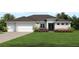 Two-car garage home with attractive landscaping at 27059 Curitiba Dr, Punta Gorda, FL 33983