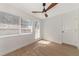 Bedroom with wood flooring, window seat, and ceiling fan at 2246 Mill Ter, Sarasota, FL 34231