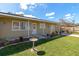 Charming ranch-style home with a landscaped front yard and bird bath at 2246 Mill Ter, Sarasota, FL 34231