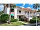 Condo building exterior view with stairs and landscaping at 4382 Madeira Ct # 3361, Sarasota, FL 34233