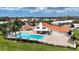 Community pool with adjacent clubhouse and patio area at 4382 Madeira Ct # 3361, Sarasota, FL 34233