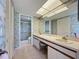 Bathroom with double vanity, a large mirror, and shower at 4382 Madeira Ct # 3361, Sarasota, FL 34233