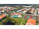 Community overview showcasing pool, tennis courts, and homes at 4382 Madeira Ct # 3361, Sarasota, FL 34233