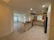 Open concept kitchen with island, stainless steel appliances, and tile flooring at 8191 Varenna Dr, Sarasota, FL 34231