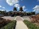Community clubhouse with palm trees and parking at 8191 Varenna Dr, Sarasota, FL 34231