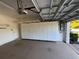 Garage with overhead storage and ample shelving at 8191 Varenna Dr, Sarasota, FL 34231