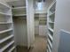 Spacious walk-in closet with custom built-in shelving at 8191 Varenna Dr, Sarasota, FL 34231