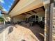 Covered patio with wicker furniture for relaxing at 8191 Varenna Dr, Sarasota, FL 34231